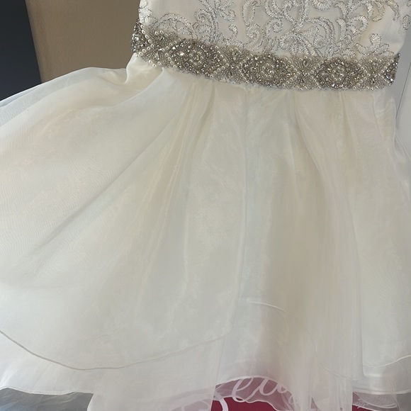 These dresses are light cream color not white but not ivory. Both for $32 - Picture 4 of 5